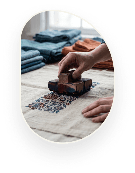 Block printing a length of fabric by hand